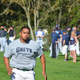 At the Pacific Association tryout in March, Daniel Baptista runs a speedy 60-yard dash, unseen by Theo Fightmaster and San Rafael Pacifics GM Mike Shapiro in the blurry background.